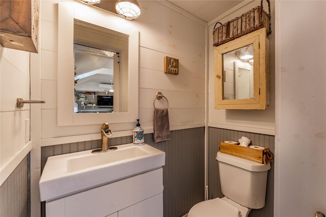 210 N Scott St, Fayetteville, TX 78940 - half bathroom featuring toilet and wood walls
