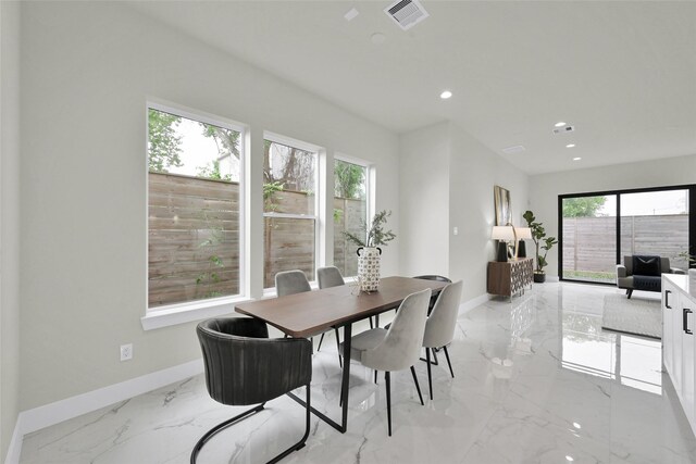 2808 Cary St Unit B, Houston, TX 77003 - dining space featuring light marble finish floors and recessed lighting