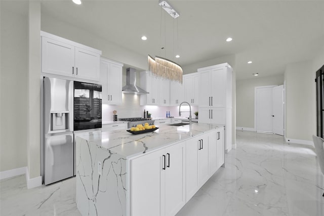 2808 Cary St Unit B, Houston, TX 77003 - kitchen with wall chimney range hood, stainless steel fridge, recessed lighting, a kitchen island with sink, and light marble finish floors