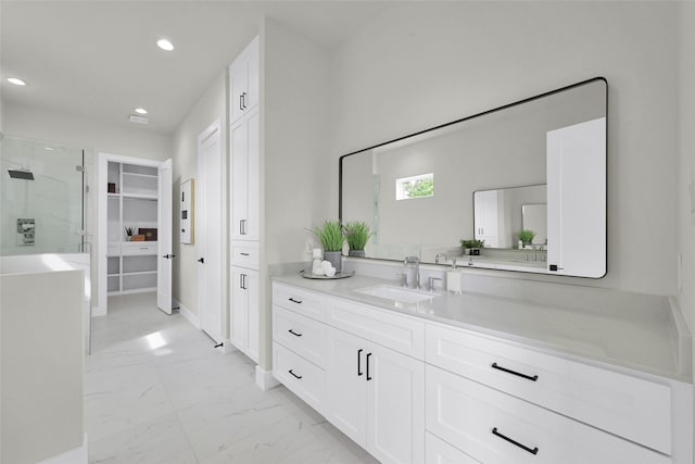 2808 Cary St Unit B, Houston, TX 77003 - bathroom featuring marble finish floors, a stall shower, vanity, a walk in closet, and recessed lighting