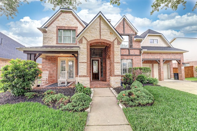 19507 Gladewater Ct, Cypress, TX 77433 - view of front facade featuring a porch, brick siding, concrete driveway, and stone siding