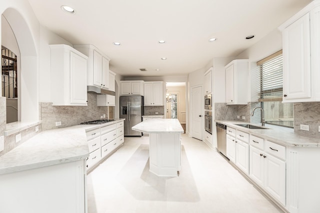 19507 Gladewater Ct, Cypress, TX 77433 - kitchen with stainless steel appliances, white cabinets, recessed lighting, decorative backsplash, and light stone countertops