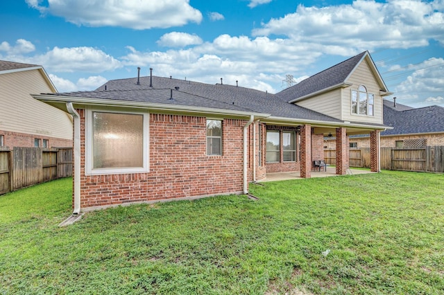 19507 Gladewater Ct, Cypress, TX 77433 - rear view of house with brick siding, a patio, a fenced backyard, and a shingled roof