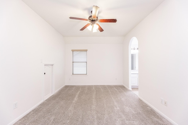 19507 Gladewater Ct, Cypress, TX 77433 - spare room featuring light carpet, a ceiling fan, and arched walkways