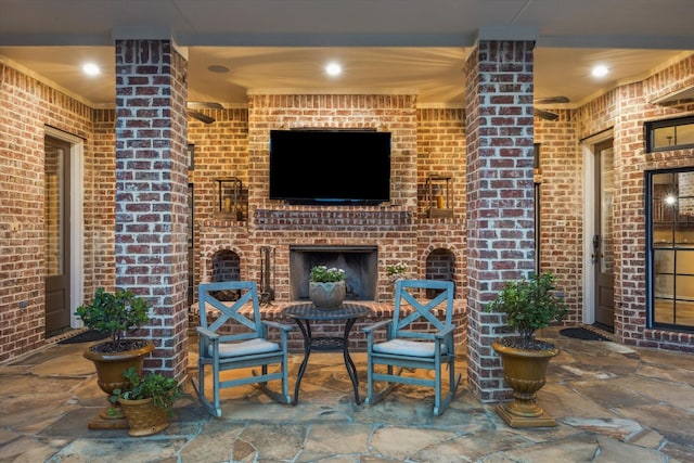 1002 Cowards Creek Ct, Friendswood, TX 77546 - view of patio / terrace featuring an outdoor brick fireplace