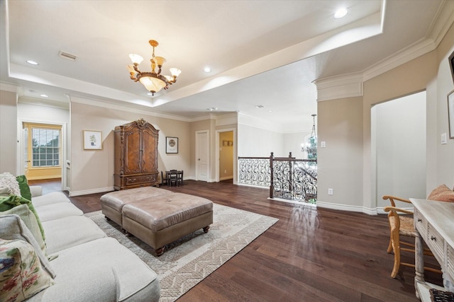 1002 Cowards Creek Ct, Friendswood, TX 77546 - living room featuring a chandelier, a raised ceiling, dark wood-type flooring, recessed lighting, and crown molding