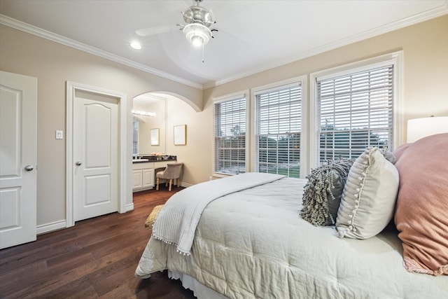 1002 Cowards Creek Ct, Friendswood, TX 77546 - bedroom with crown molding, dark wood-style flooring, arched walkways, recessed lighting, and ensuite bath