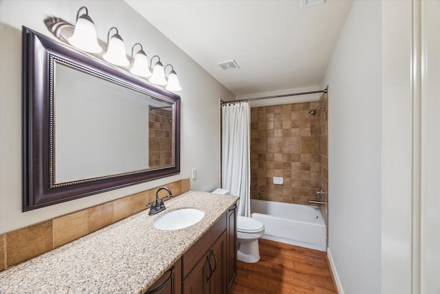 1002 Cowards Creek Ct, Friendswood, TX 77546 - bathroom with vanity, shower / bath combo, and wood finished floors
