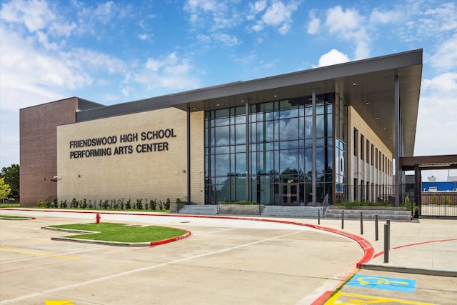 1002 Cowards Creek Ct, Friendswood, TX 77546 - view of building exterior with uncovered parking