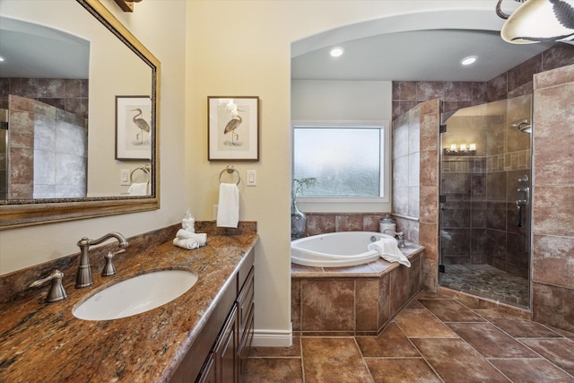 1002 Cowards Creek Ct, Friendswood, TX 77546 - bathroom with a bath, a stall shower, vanity, and recessed lighting