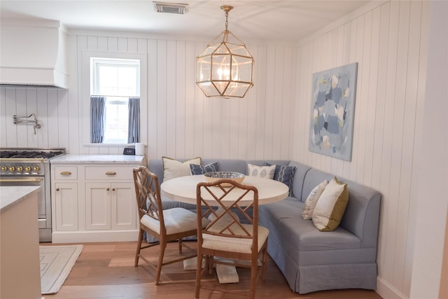 7611 Fairdale Ln, Houston, TX 77063 - dining space featuring breakfast area, light wood finished floors, and a chandelier