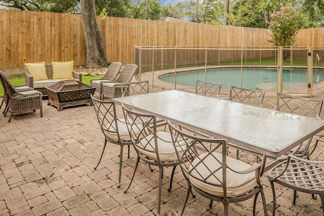 7611 Fairdale Ln, Houston, TX 77063 - view of pool featuring an outdoor fire pit, a fenced backyard, and a patio area