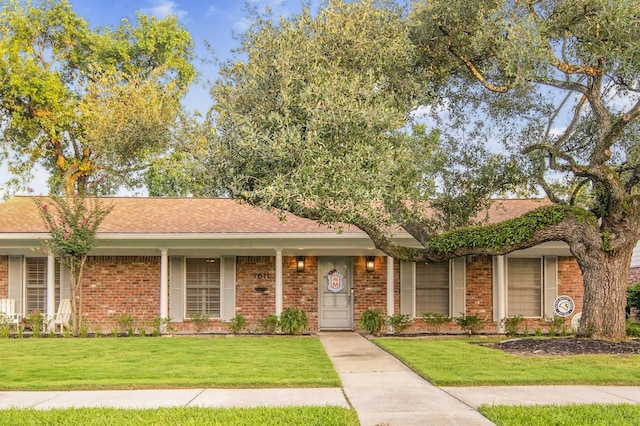 7611 Fairdale Ln, Houston, TX 77063 - ranch-style home featuring a front yard and brick siding