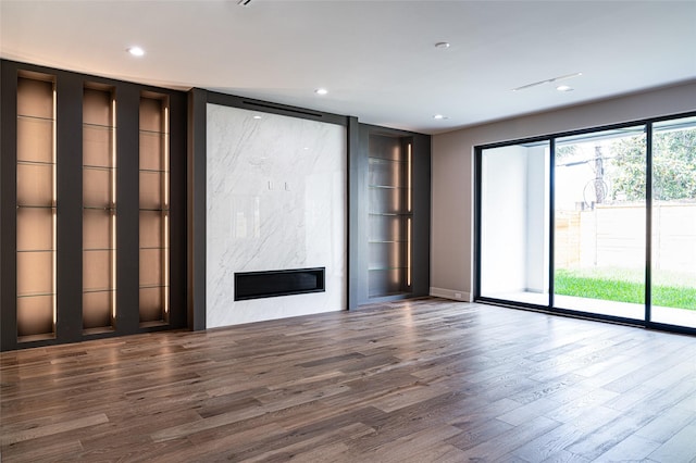 2222 Branard St, Houston, TX 77098 - unfurnished living room featuring wood finished floors, a fireplace, and recessed lighting