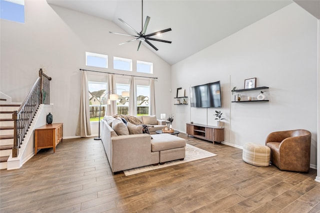 13110 Mid Stocket Dr, Humble, TX 77346 - living area with high vaulted ceiling, a ceiling fan, wood finished floors, and stairway