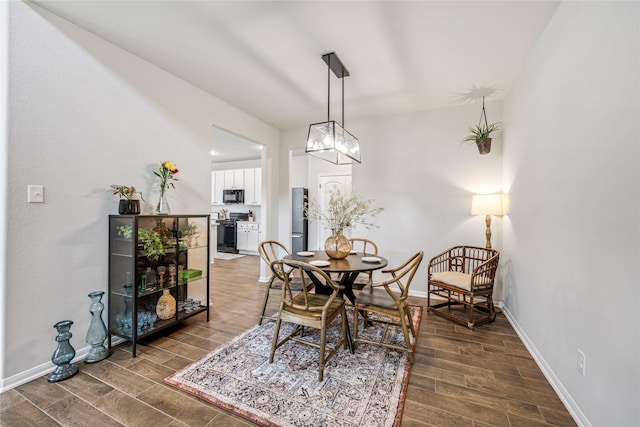 13110 Mid Stocket Dr, Humble, TX 77346 - dining room featuring wood finished floors and baseboards