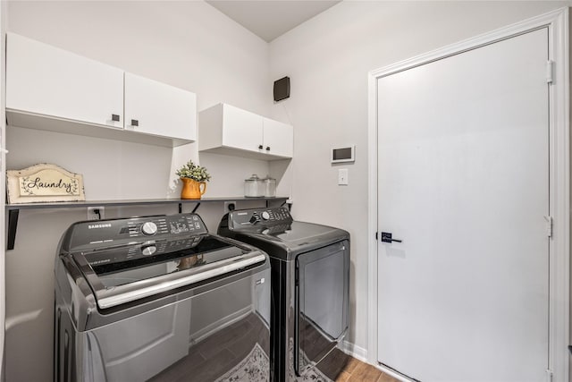 13110 Mid Stocket Dr, Humble, TX 77346 - laundry room featuring cabinet space, independent washer and dryer, and light wood-style flooring