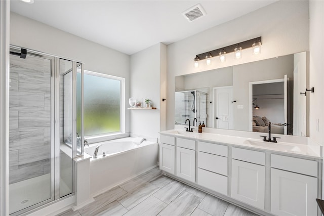 13110 Mid Stocket Dr, Humble, TX 77346 - full bath with a bath, a stall shower, double vanity, and marble look tile flooring