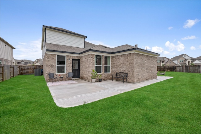 13110 Mid Stocket Dr, Humble, TX 77346 - back of property with a fenced backyard, brick siding, a patio area, and a shingled roof