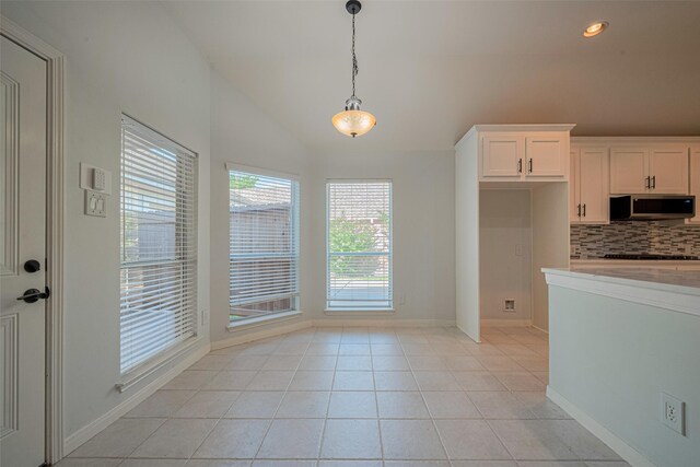 11607 Buck Springs Trl, Tomball, TX 77377 - unfurnished dining area featuring light tile patterned floors, recessed lighting, and high vaulted ceiling