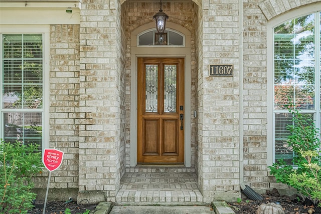 11607 Buck Springs Trl, Tomball, TX 77377 - view of exterior entry featuring brick siding