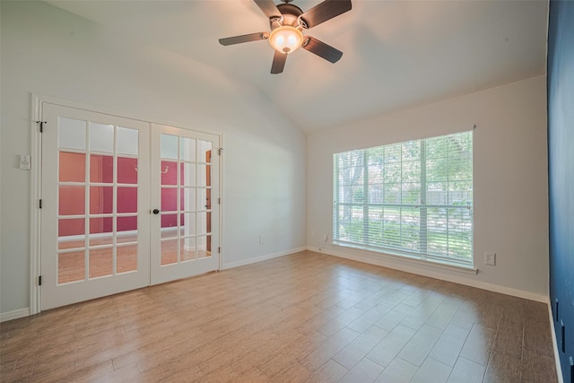 11607 Buck Springs Trl, Tomball, TX 77377 - spare room featuring french doors, vaulted ceiling, ceiling fan, and wood finished floors