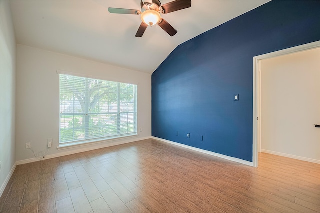 11607 Buck Springs Trl, Tomball, TX 77377 - spare room featuring lofted ceiling, wood finished floors, and a ceiling fan