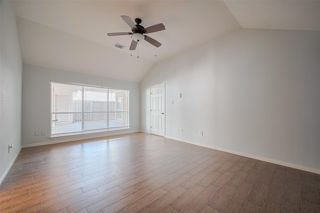 11607 Buck Springs Trl, Tomball, TX 77377 - empty room with lofted ceiling, wood finished floors, and a ceiling fan