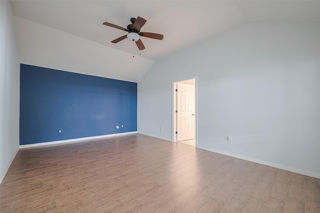 11607 Buck Springs Trl, Tomball, TX 77377 - spare room with lofted ceiling, a ceiling fan, and wood finished floors
