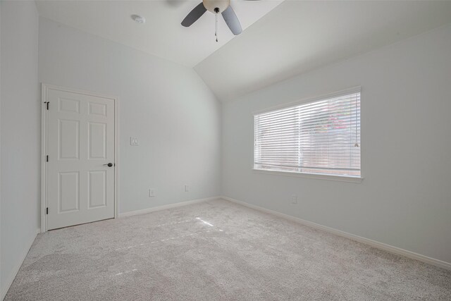 11607 Buck Springs Trl, Tomball, TX 77377 - empty room featuring light colored carpet, ceiling fan, lofted ceiling, and a smoke detector