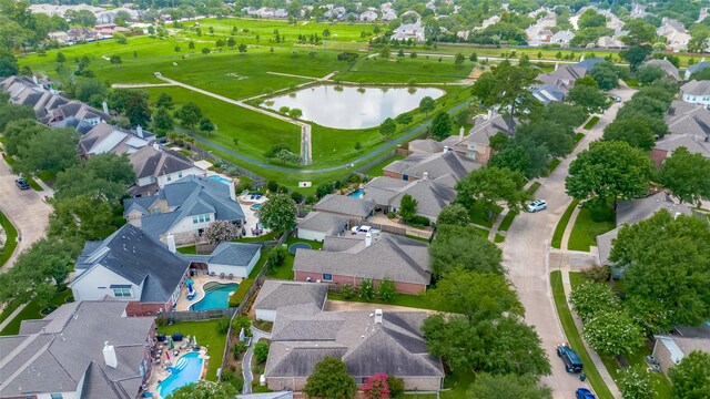 11607 Buck Springs Trl, Tomball, TX 77377 - aerial view of residential area with a pool and a large body of water