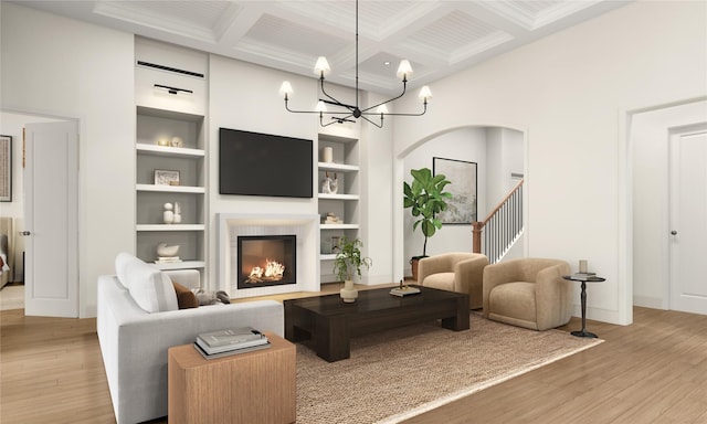 1002 E 25th St, Houston, TX 77009 - living room featuring coffered ceiling, wood finished floors, beam ceiling, built in features, and a chandelier