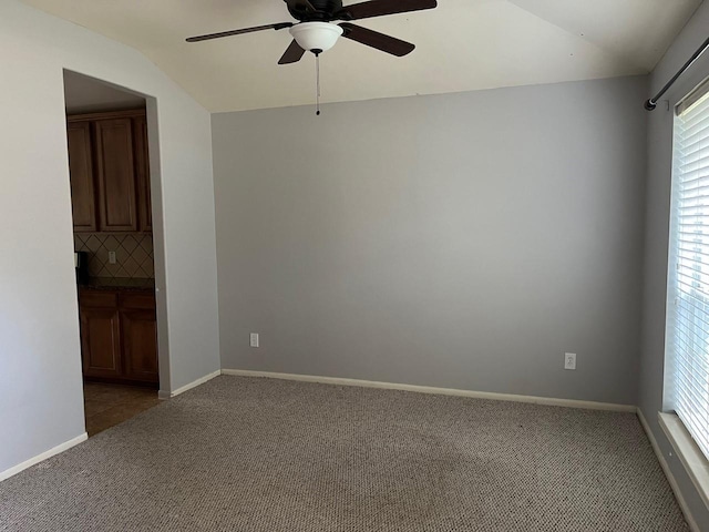 12610 Bethany Bay Dr, Pearland, TX 77584 - spare room featuring light carpet, a ceiling fan, and vaulted ceiling