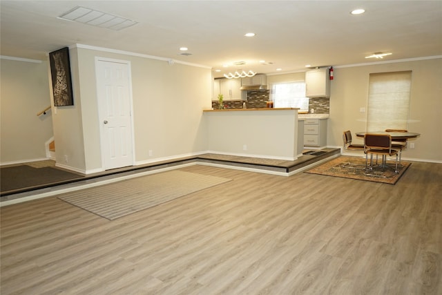 11822 Bandlon Dr, Houston, TX 77072 - unfurnished living room featuring ornamental molding, wood finished floors, recessed lighting, and stairs