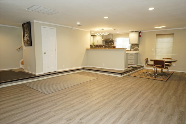 11822 Bandlon Dr, Houston, TX 77072 - unfurnished living room featuring ornamental molding, wood finished floors, recessed lighting, and stairs