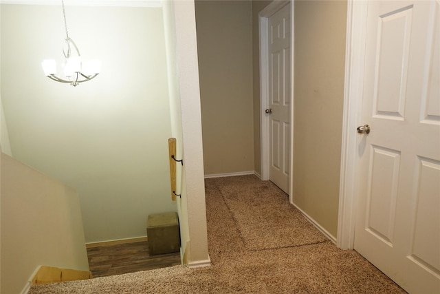 11822 Bandlon Dr, Houston, TX 77072 - corridor featuring carpet floors and a chandelier
