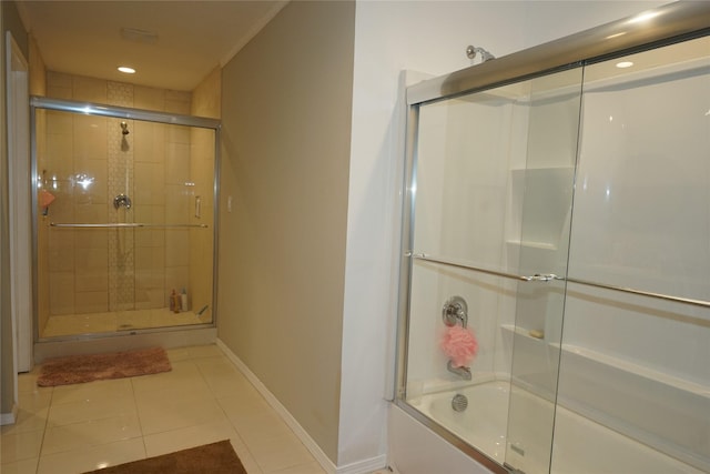 11822 Bandlon Dr, Houston, TX 77072 - bathroom with shower / bath combination with glass door, tile patterned flooring, and recessed lighting