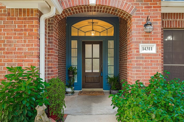 14311 Cally Cir, Needville, TX 77461 - view of exterior entry featuring brick siding