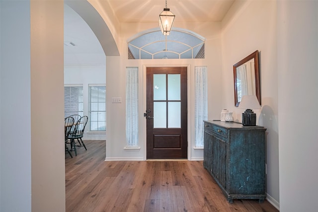 14311 Cally Cir, Needville, TX 77461 - foyer entrance featuring wood finished floors and arched walkways