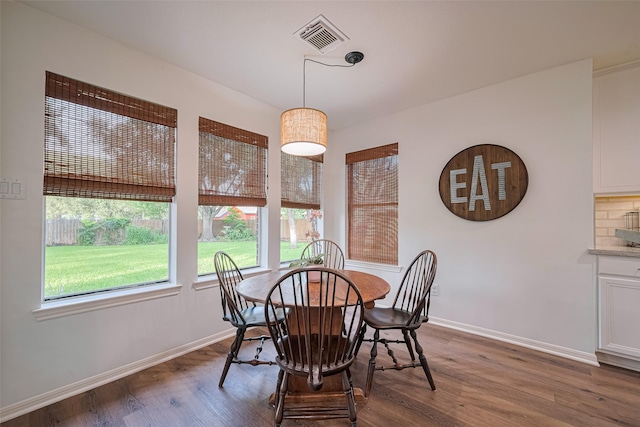 14311 Cally Cir, Needville, TX 77461 - dining area featuring baseboards and dark wood-style floors