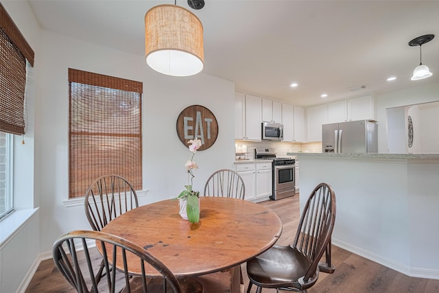 14311 Cally Cir, Needville, TX 77461 - dining area with light wood-type flooring and recessed lighting