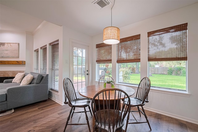 14311 Cally Cir, Needville, TX 77461 - dining space featuring wood finished floors and ornamental molding