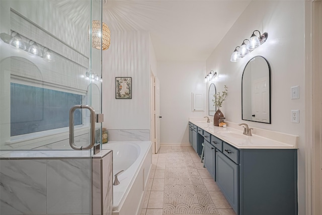 14311 Cally Cir, Needville, TX 77461 - full bathroom featuring double vanity, a garden tub, a shower stall, and tile patterned flooring