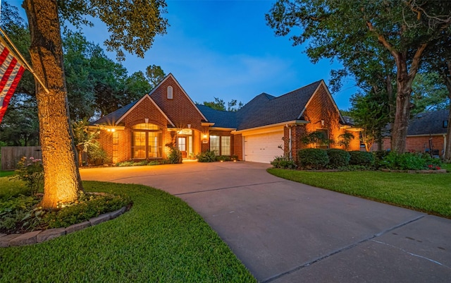 14311 Cally Cir, Needville, TX 77461 - view of front of property with brick siding, driveway, and an attached garage
