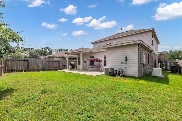 10211 Norway Spruce Ln, Tomball, TX 77375 - back of property featuring a patio area, a fenced backyard, and brick siding
