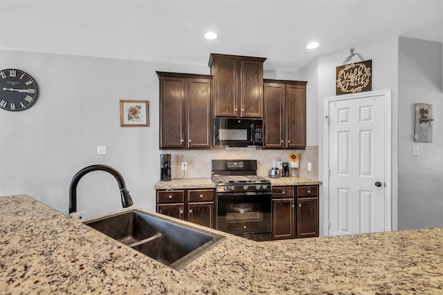 10211 Norway Spruce Ln, Tomball, TX 77375 - kitchen with black appliances, decorative backsplash, dark brown cabinetry, light stone counters, and recessed lighting