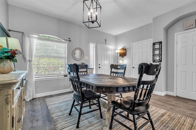 10211 Norway Spruce Ln, Tomball, TX 77375 - dining room with wood finished floors and a chandelier