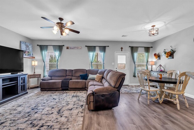 10211 Norway Spruce Ln, Tomball, TX 77375 - living room with plenty of natural light, ceiling fan, and wood finished floors
