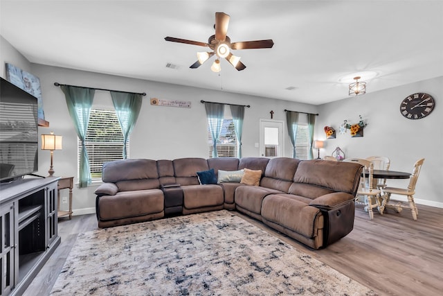 10211 Norway Spruce Ln, Tomball, TX 77375 - living room featuring plenty of natural light, a ceiling fan, and wood finished floors
