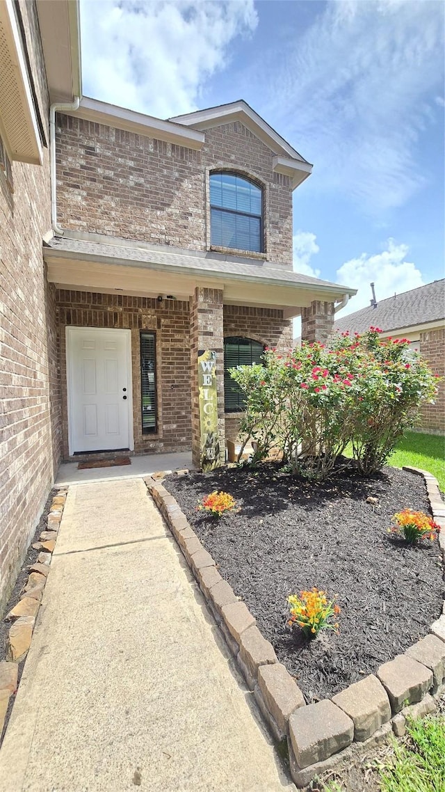 10211 Norway Spruce Ln, Tomball, TX 77375 - view of exterior entry featuring brick siding